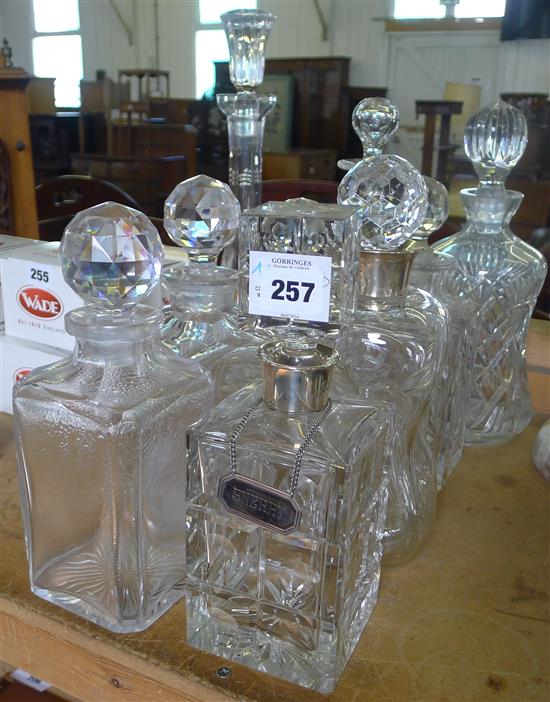 Collection of cut glass ware incl decanters with silver labels, etc